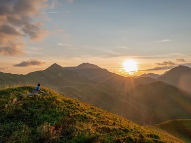 Sunrise with a man on a Ultra trekking mat 