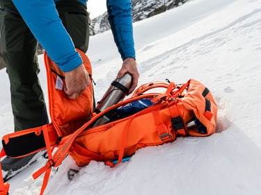 in use image Couloir dark lava taking out a bottle from the back side
