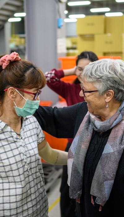 EXPED Founder Heidi Brun with Feng Yi Worker