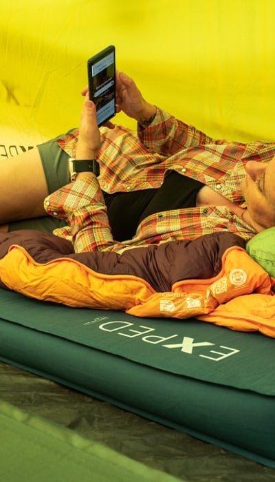 Person relaxing on Deepsleep camping mat