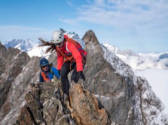 climbing on top of the mountain