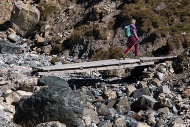 hiking over bridge